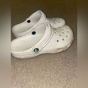 2 pairs of regular white crocs Dirty, could be cleaned no issues with material